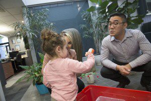 Dr jasper lee, sharing our famous big red box with a young patient