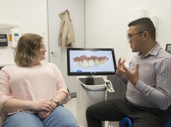 Dr Jasper Lee, associate dentist discussing the use of digital dentistry with a patient